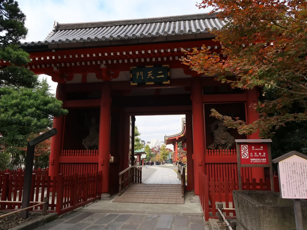 Nitenmon Gate at Sensoji Temple in Asakusa Tokyo with autumn leaves and fewer tourists in the morning