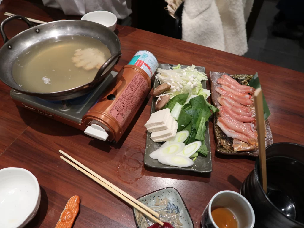 japanese hot pot ingredients and cooking at table